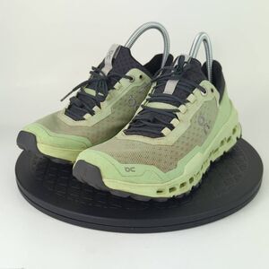 On Running Athletic Shoes in Green and Black